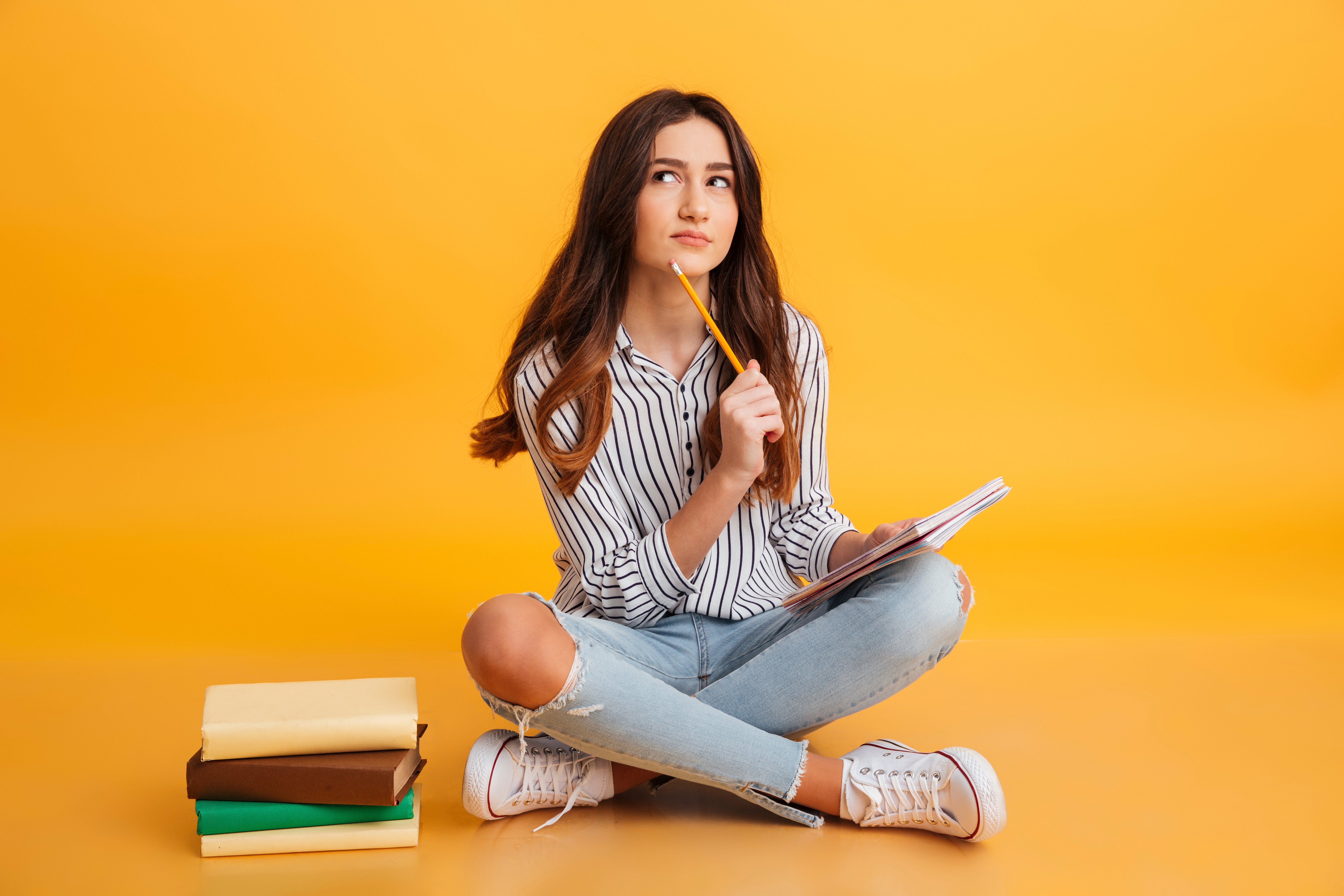 portrait-pensive-young-girl-making-notes portrait-pensive-young-girl-making-notes